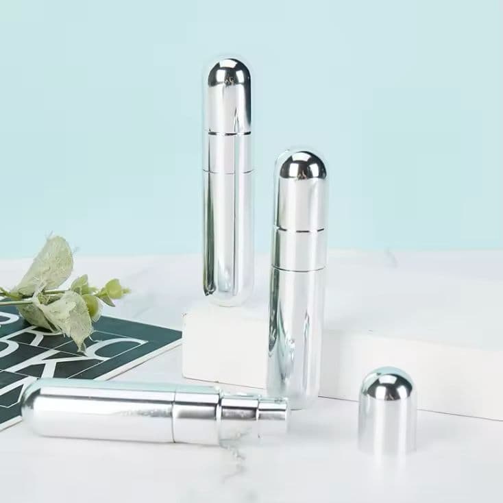 Refillable perfume spray